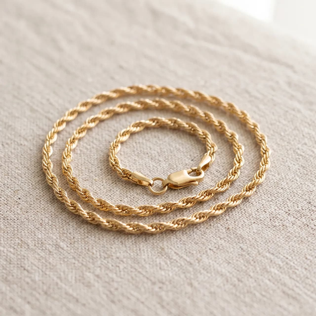 Gold chain with clasp on linen
